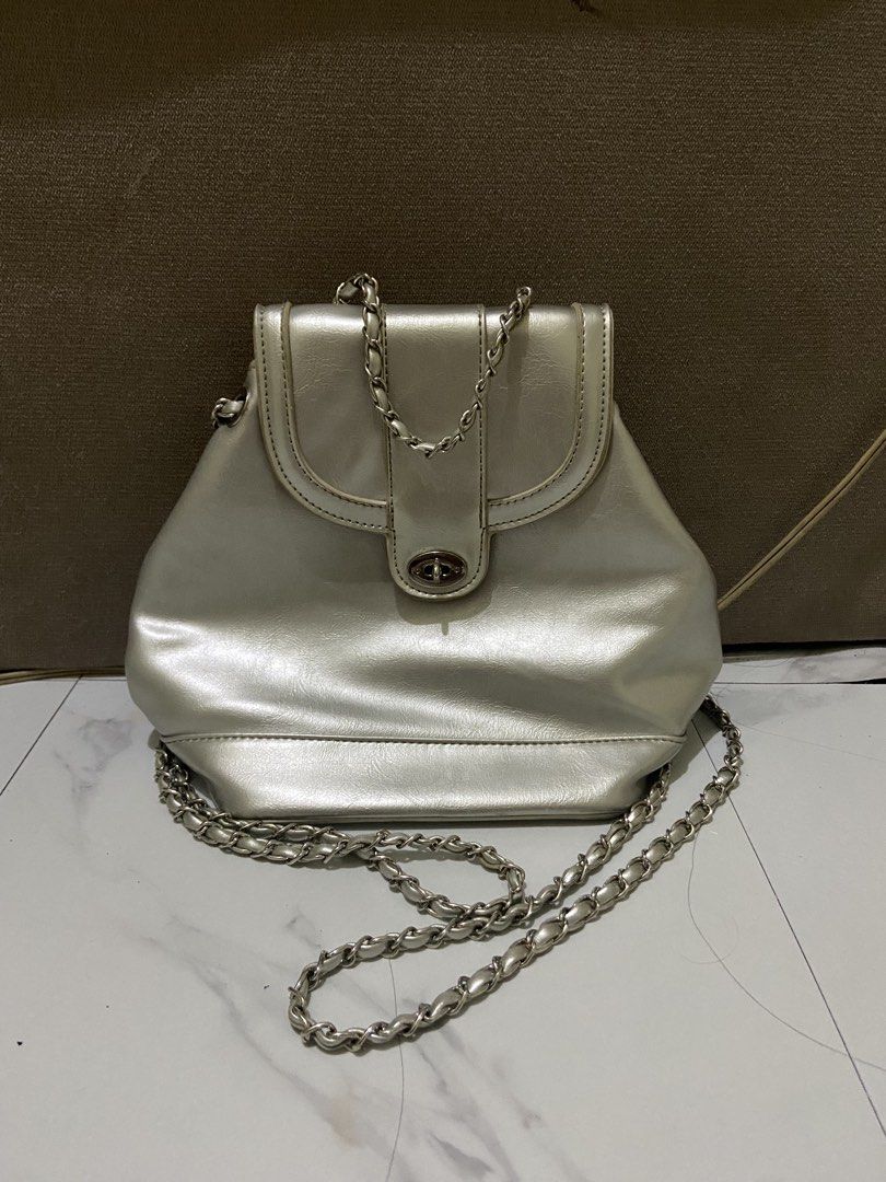 [RUSH SALE] Silver Metallic Chain Mini Backpack (Category: Backpacks) located in Pasig City. Submitted by ellerarissime (Listing ID 1469283731, Image 1). Description: RFS: Decluttering. Sales are slightly negotiable. PM for more item inquiries. Loc: Santolan, Pasig.