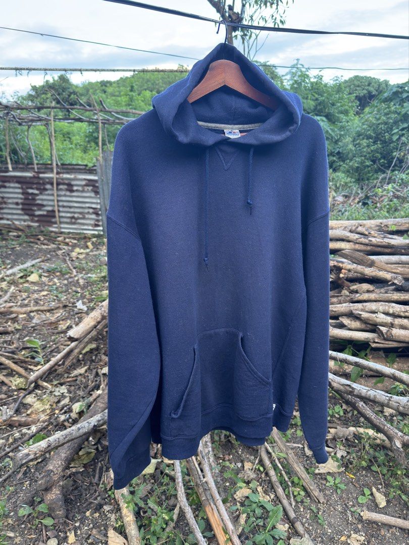 Russell Athletic Navy Blue Hoodie (Category: Coats, Jackets and Outerwear) located in Batangas. Submitted by Treasure.vtg (Listing ID 1469239967, Image 1). Description: - Brand/Model: Russell Athletic Hoodie - Color: Navy Blue - Size: XXL - Material: 50% cotton, 50% polyester (Made in Honduras) - Features: Thick fabric, soft interior lining, front kangaroo pocket, adjustable drawstring hood - Fit: Regular fit, perfect as an everyday basic.