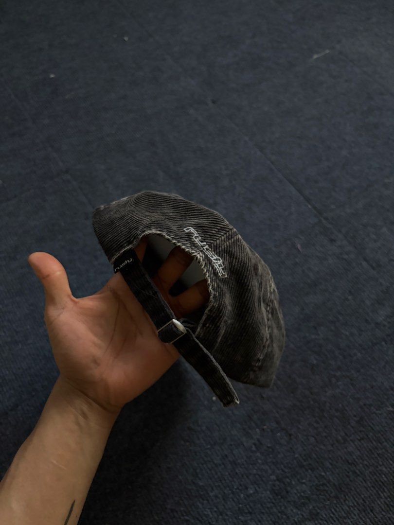 Rusty Corduroy Cap Dark Grey Blue (Category: Caps & Hats) located in Manila. Submitted by toys_hats005 (Listing ID 1469183971, Image 2). Description: - Brand: Rusty - Color: Dark grey and blue - Material: Corduroy fabric - Design: Structured panels, curved brim, and embroidered logo lettering on the front and side - Fit: Adjustable back strap with metal slide - Condition: Clean interior lining, includes original paper inserts for shape retention.