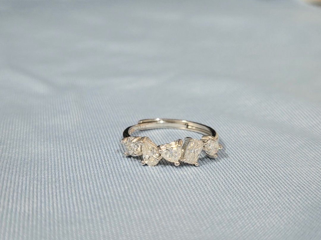 S925 Silver multi-shape moissanite stone ring (Category: Rings) located in Manila. Submitted by fayiefar (Listing ID 1469290341, Image 1). Description: - Design: Silver ring with 5 multi-cut moissanite stones (round, pear, heart, rectangular,oval) - Fit: Adjustable band - Condition: Brand new - with S925 stamp - Inclusions: Comes with authenticity certification card .