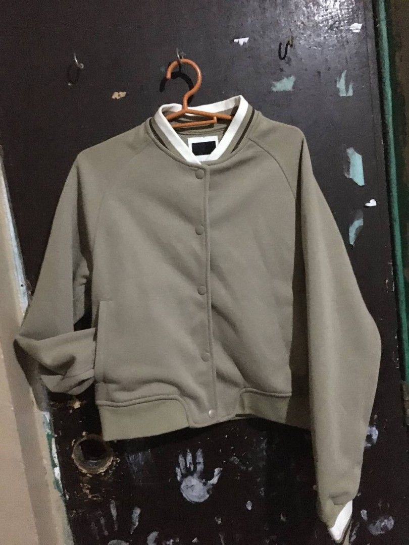 Sage Green Bomber Jacket Snap Button Size M (Category: Coats, Jackets and Outerwear) located in Quezon City. Submitted by mahiwagangkamote (Listing ID 1469368959, Image 1). Description: - Color: Sage green with white and dark green striped ribbed collar, cuffs, and hem - Closure: Snap button - Pockets: Two front pockets - Size: EUR M, USA M, MEX 40 - Origin: Made in Vietnam - Condition: Clean inside and out, ready to wear rfs: regalo ng ex hahaha