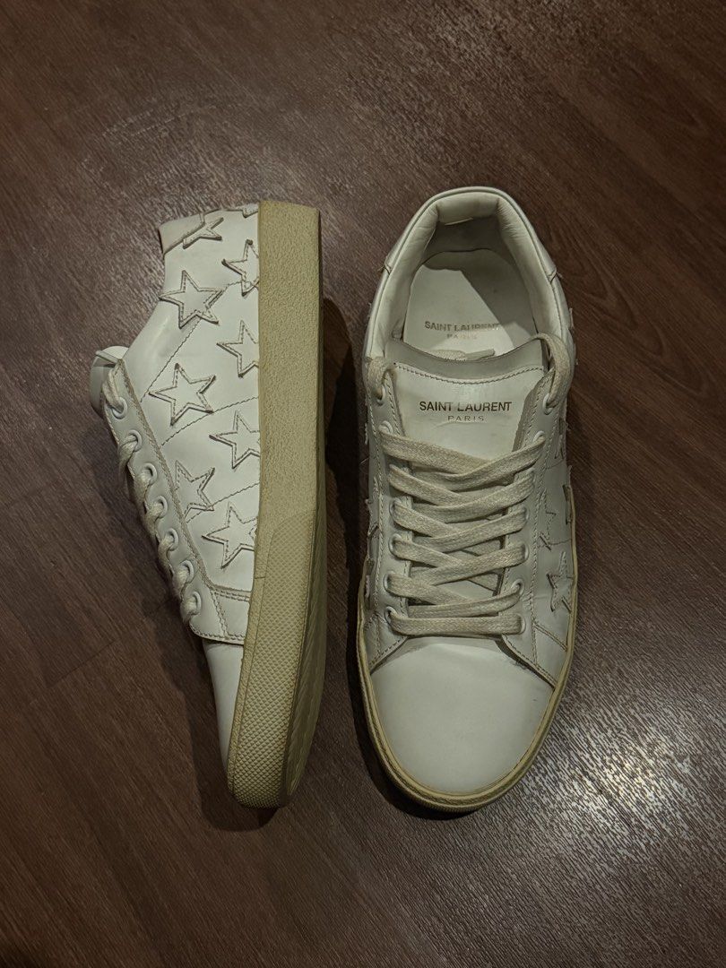Saint Laurent Court Classic SL/06 (Category: Sneakers & Footwear) located in Caloocan City. Submitted by businessrobroque (Listing ID 1469259366, Image 1). Description: - Brand: Saint Laurent Court Classic - Color/Material: White leather with off-white rubber soles - Size: 42 (Made in Italy) - Style Code: GE 485585 - Features: Star appliqués on sides, gold foil logo on tongue and heel - Condition: Minimal upper creasing, clean interior, intact in