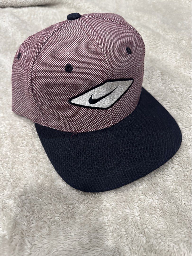 Sam's Cap Nike Maroon Black Hat One Size Fits All (Category: Caps & Hats) located in Manila. Submitted by prelovedbyethanj (Listing ID 1469295126, Image 1). Description: - Color: Maroon and black patterned - Brand: Nike (embroidered front logo patch) - Size: One size fits all with an adjustable back strap - Material: 20% wool, 80% acrylic blend (Made in Korea by Sam's Cap) - Condition: Clean interior and well-structured panels used rarely rfs: de