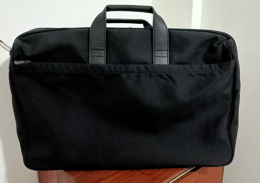 Samsonite Black Briefcase/Business Bag (Category: Briefcases) located in Siniloan. Submitted by treyyasonlineshop (Listing ID 1469386588, Image 2). Description: -Approx: 20"x14" Replaced sling strap Brand: Samsonite - Color: Classic Black - Material: Durable nylon - Strap: Adjustable and removable shoulder strap for versatile carry - Storage: Dual main compartments with multiple interior organizer pockets and pen slots - Details: Silver metal zip