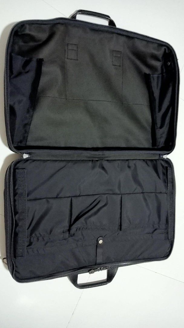 Samsonite Black Briefcase/Business Bag (Category: Briefcases) located in Siniloan. Submitted by treyyasonlineshop (Listing ID 1469386588, Image 3). Description: -Approx: 20"x14" Replaced sling strap Brand: Samsonite - Color: Classic Black - Material: Durable nylon - Strap: Adjustable and removable shoulder strap for versatile carry - Storage: Dual main compartments with multiple interior organizer pockets and pen slots - Details: Silver metal zip
