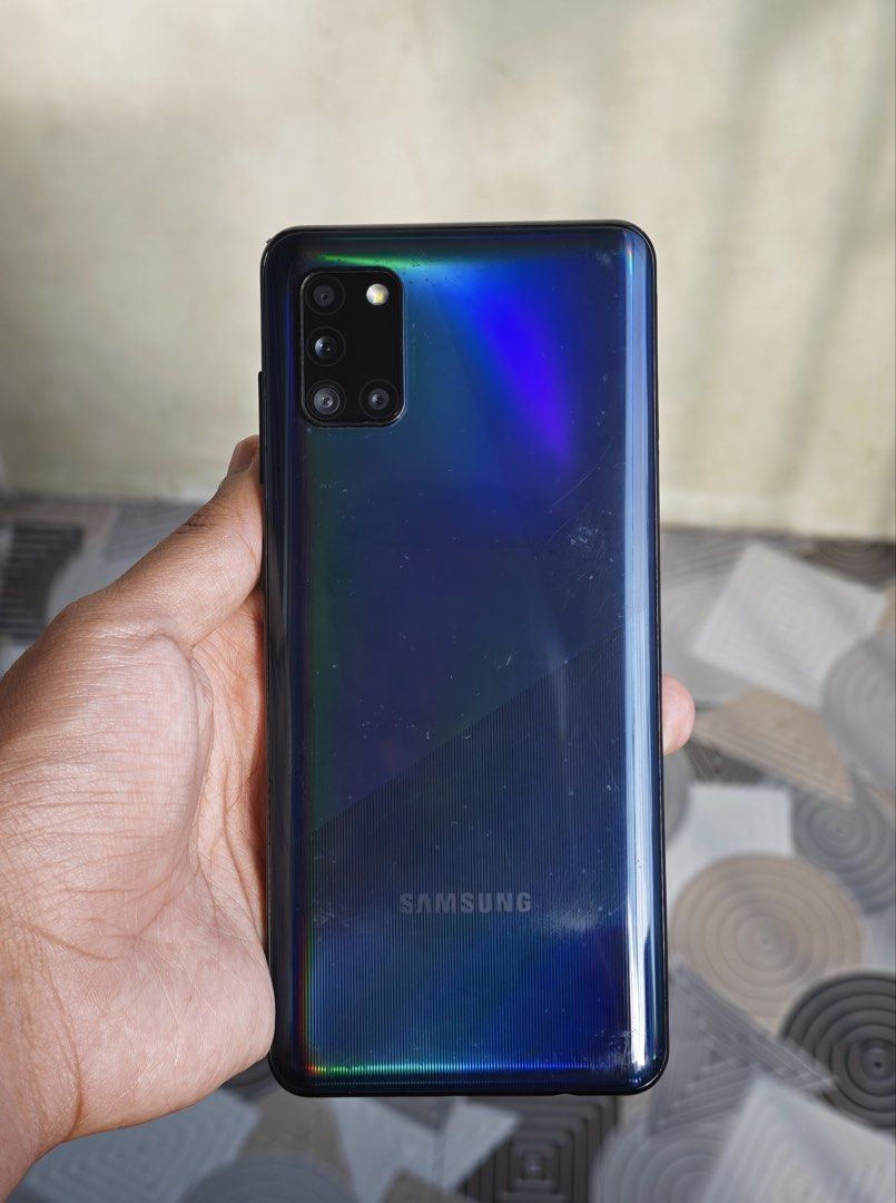 Samsung Galaxy A31 6/128gb Openline (Category: Samsung) located in Manila. Submitted by b1uezy (Listing ID 1469220984, Image 1). Description: -Color: Black -Used condition -All original parts -All functional (fingerprint, cameras, etc.) -No issues functionality wise -Cosmetic issues (scratches in back) Negotiable Location: QC.