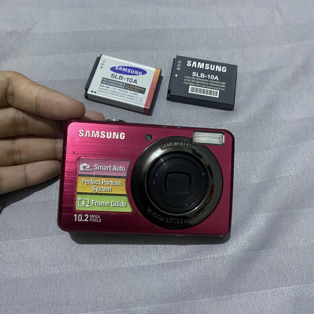 samsung sl202 📸 | working with issue (description) (Category: Cameras) located in Tarlac. Submitted by jelugh (Listing ID 1469297865, Image 1). Description: samsung sl202 📸 | for repair/ parts 🏷️ 1k with 2 batteries (1 old & 1 new) ps. send me a dm on blue (on my bio) so i can send u a vid about the condition issue: need huliin ung lens pag lumabas pagkaon. kapag di hinihuli, bumabalik paloob lens. output niya is reddish kapag may flash ewan k