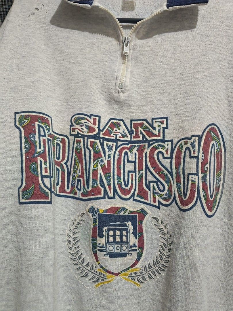 San Francisco quarter zip jacket (Category: Hoodies) located in Tarlac. Submitted by yohfinds (Listing ID 1469319248, Image 2). Description: has pin hole.