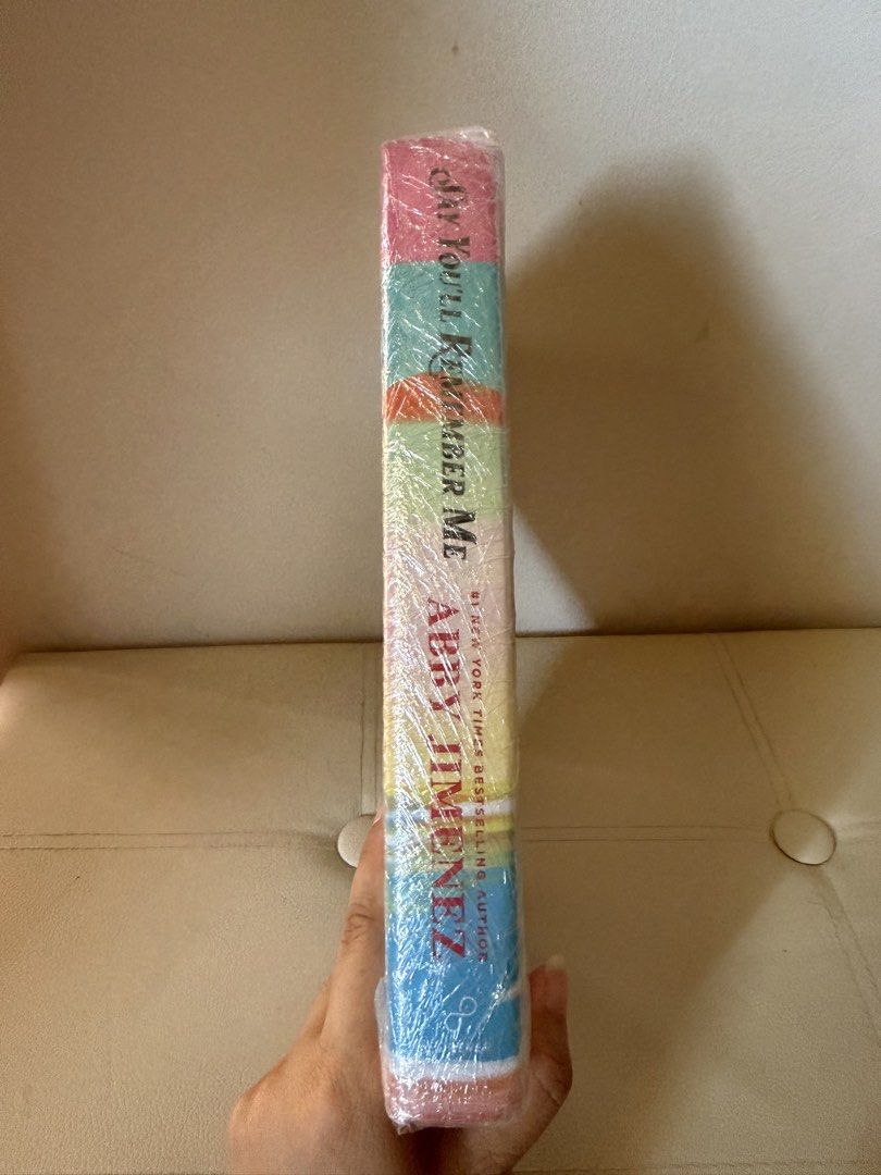 Say You'll Remember Me by Abby Jimenez (Category: Storybooks) located in Zamboanga. Submitted by nini_0423 (Listing ID 1468877153, Image 3). Description: - Title: Say You'll Remember Me - Author: Abby Jimenez - Format: Hardcover edition with vibrant beach cover artwork - Condition: Brand new, still sealed in original plastic film protection - Perfect for: Romance book lovers and collectors.
