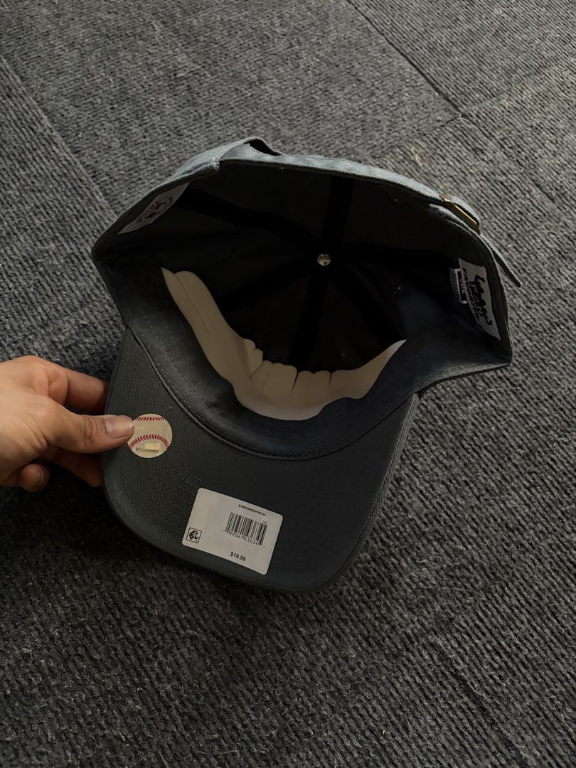Seattle Mariners MLB Adjustable Cap Grey (Category: Caps & Hats) located in Manila. Submitted by toys_hats005 (Listing ID 1469183726, Image 3). Description: - Brand: Seattle Mariners - Color: Dark Grey - Condition: Brand new with original store tags - Fit: Classic dad hat with curved brim - Details: Embroidered gold and white team logo on the front - Closure: Adjustable strap with metal hardware.
