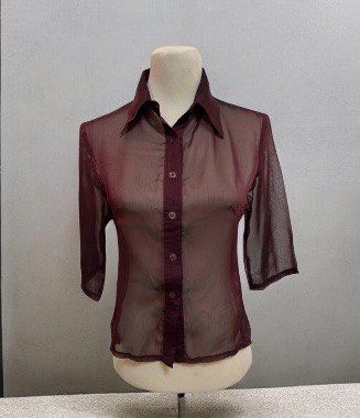 See-thru Maroon Sheer Button Down Shirt Size M (Category: Blouses) located in Quezon City. Submitted by letsdeclutter101 (Listing ID 1469380261, Image 1). Description: - Brand/Label: Couture - Size: Medium (tag on collar) - Color: Maroon - Material: Lightweight sheer mesh with slight see-through finish - Design: Classic collared neckline, front button placket, and half sleeves - Detail: Solid fabric panel running down the collar and button line.