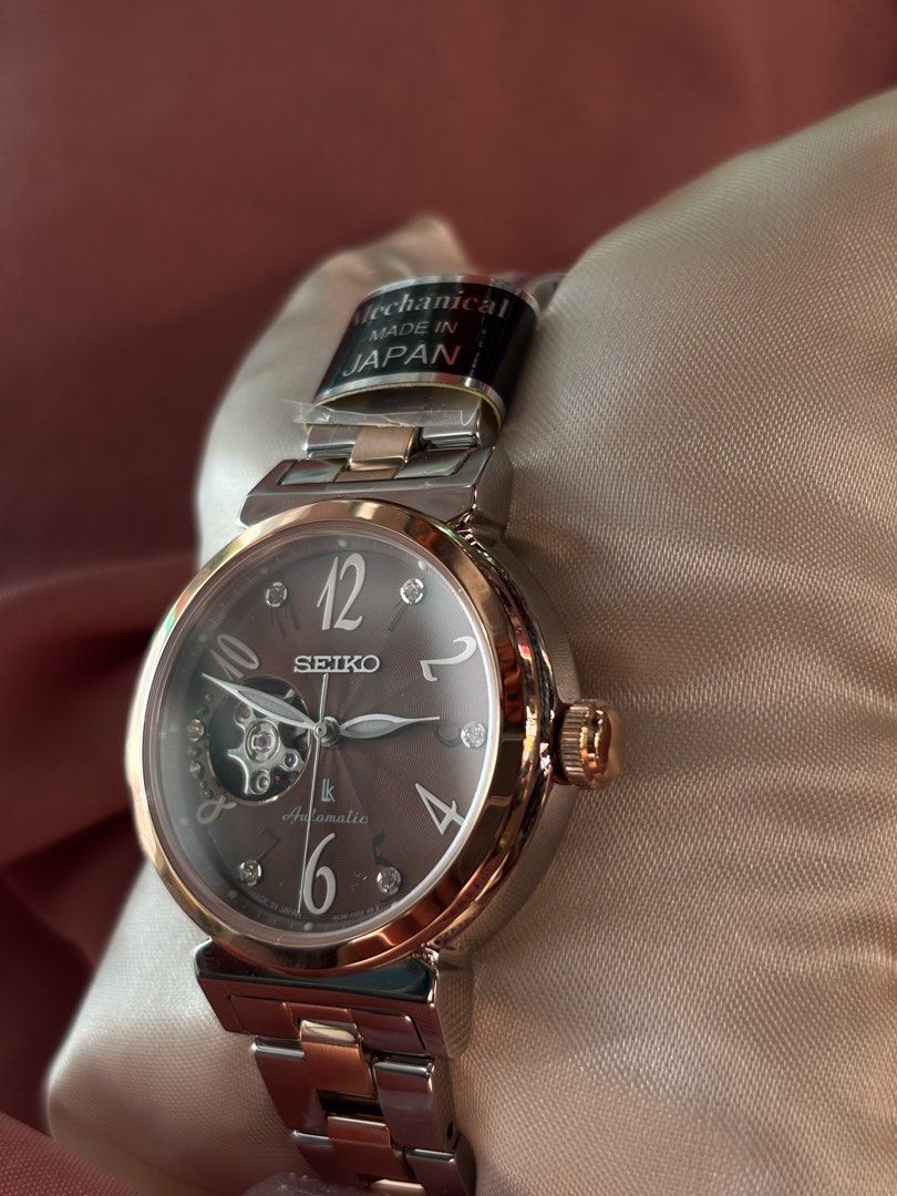 Seiko Lukia Essential Collection Automatic Watch (Model SSVM062) (Category: Women's Watches) located in Manila. Submitted by angelodelgado (Listing ID 1469347756, Image 3). Description: 🤎 Elegant Brown Dial with Rose Gold Finish ⌚ Automatic Movement 💎 Open Heart Design 🇯🇵 Made in Japan ✨ Classy and timeless design — perfect for everyday wear or formal occasions! 📦 Complete with bracelet and protective films (as shown) 💰 PRICE: 23,000 📩 Mes