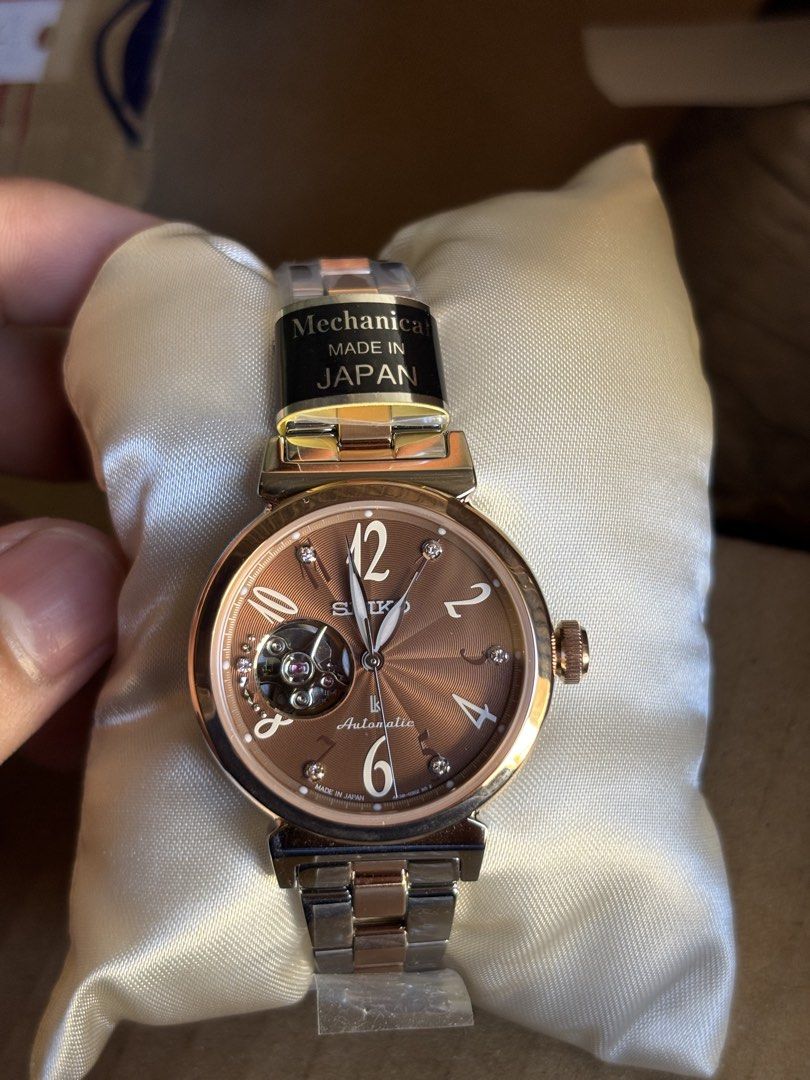 Seiko Lukia Essential Collection Automatic Watch (Model SSVM062) (Category: Women's Watches) located in Manila. Submitted by angelodelgado (Listing ID 1469347756, Image 2). Description: 🤎 Elegant Brown Dial with Rose Gold Finish ⌚ Automatic Movement 💎 Open Heart Design 🇯🇵 Made in Japan ✨ Classy and timeless design — perfect for everyday wear or formal occasions! 📦 Complete with bracelet and protective films (as shown) 💰 PRICE: 23,000 📩 Mes