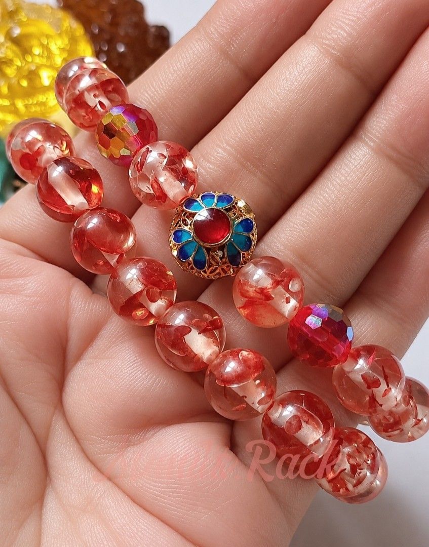 SET! 2PCS ORANGE FLOWER AMBER BRACELET (Category: Bracelets) located in Taguig. Submitted by mimisrack (Listing ID 1469302352, Image 3). Description: 🧡Warm glow. Natural beauty. -2pcs matching bracelets - perfect for stacking or sharing -A lovely amber set for everyday wear or gifting -physical healing, energy and protection, self-confidence, emotional stability and release of stress 🧿 Bead size: 10mm 🧿 charm size: 13mm 🧿 eed crystal: 9mm 🧿 