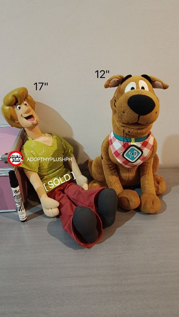 Shaggy & Scooby Doo Talking Plush (Category: Interactive Toys) located in Taguig. Submitted by adopt.my.plush.ph (Listing ID 1469302598, Image 1). Description: 800.00 each *vid available in our blue app page 12" Snack Attack Scooby-Doo Talking Plush Manufacturer: Character Options Ltd. Features: Switch him on to hear him say ‘I’m snack attack Scooby’ and laughs. Wears a red-white checkered bandana with the iconic "SD" emblem charm with sensor in 