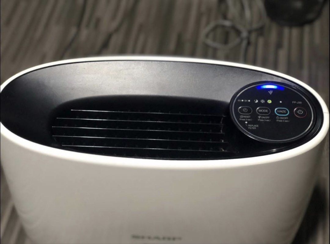 Sharp FP-J30E Air Plasmacluster Air Purifier (Category: Air Purifiers & Dehumidifiers) located in Cavite. Submitted by grandearth.39df3f (Listing ID 1469163879, Image 3). Description: Sharp FP-J30E Plasmacluster air purifier in white and black. Cleans up to 23 square meters. HEPA filter inside. Touch control panel on top with blue indicator light. Plugs into standard wall outlet. Keeps room air fresh and clean. Compact size fits easily on the flo