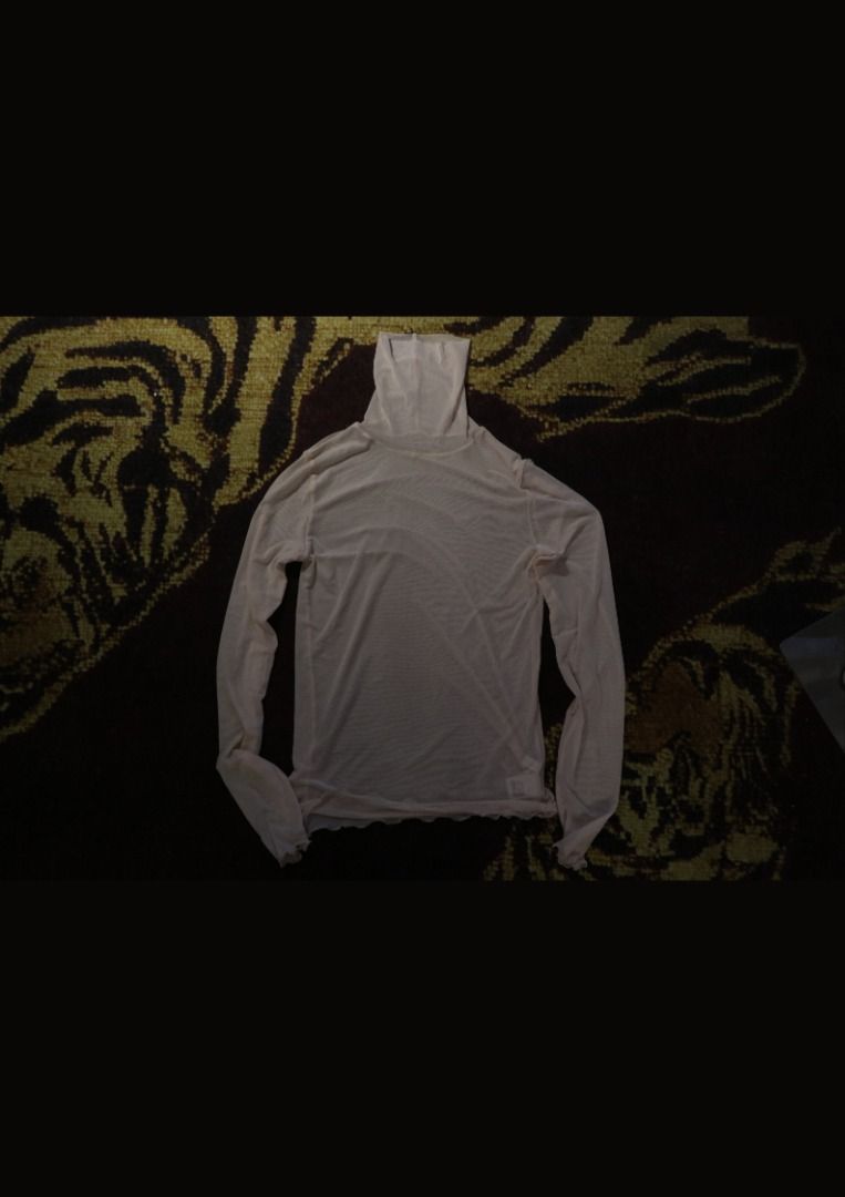 Sheer Mesh Turtleneck Long Sleeve Top Beige (Category: Longsleeves) located in Paranaque City. Submitted by skulkch (Listing ID 1469362257, Image 3). Description: - Color: Classic neutral beige - Style: Sheer mesh turtleneck top with long sleeves - Details: Chic lettuce hem on cuffs and bottom hem - Fit: Stretchy, lightweight, and breathable fabric - Versatility: Great for layering under sweaters or wearing solo.
