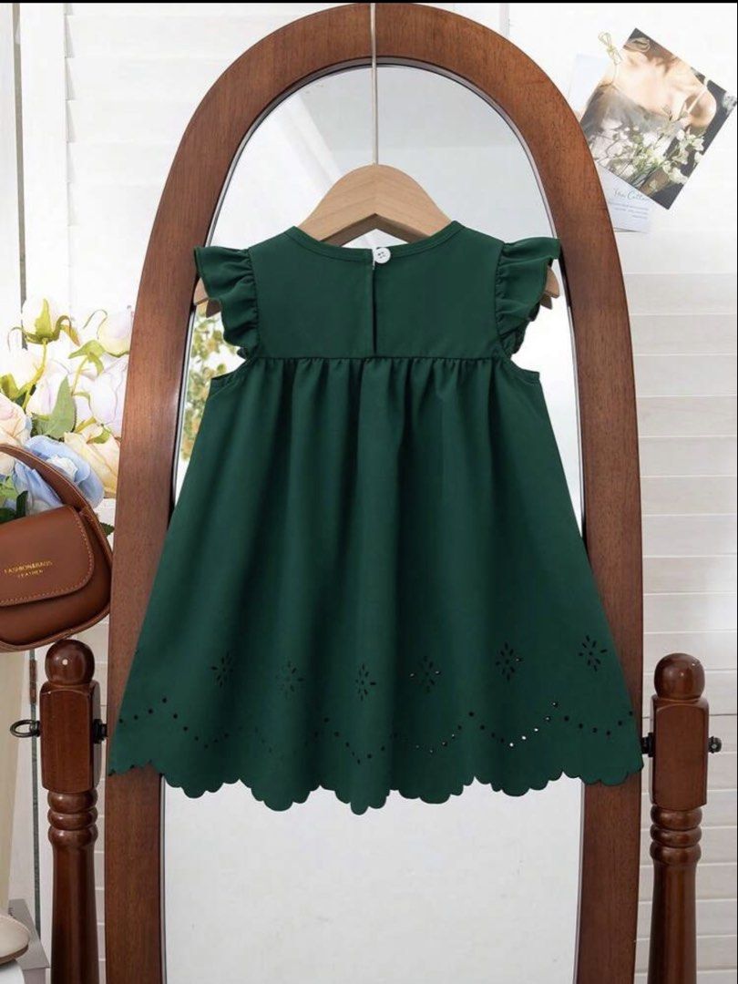 Shein Dark green dress (Category: Babies & Kids Fashion) located in Manila. Submitted by monstershaaa (Listing ID 1469164517, Image 2). Description: used once only - wedding event 18-24 months no damage - no issue rfs : small na kay baby girl - Size: 18-24 months - Color: Dark green - Design: Cap sleeves with ruffles, sweet front bowknot - Details: Scalloped hem with delicate cut-out burn-out embroidery - Closure: Convenient button closure at the
