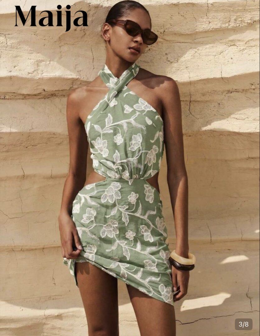 Shein Dress (Category: Dresses) located in Paranaque City. Submitted by ak143 (Listing ID 1469393015, Image 3). Description: - Brand: Maija - Style: Green halter neck mini dress with white embroidered floral pattern - Fit & Features: Cross-neck design with back tie, chic waist cutouts, and a stretchy smocked back panel - Fabric: Lightweight, comfortable, and perfect for casual outings or dates - Condition: Excellent.