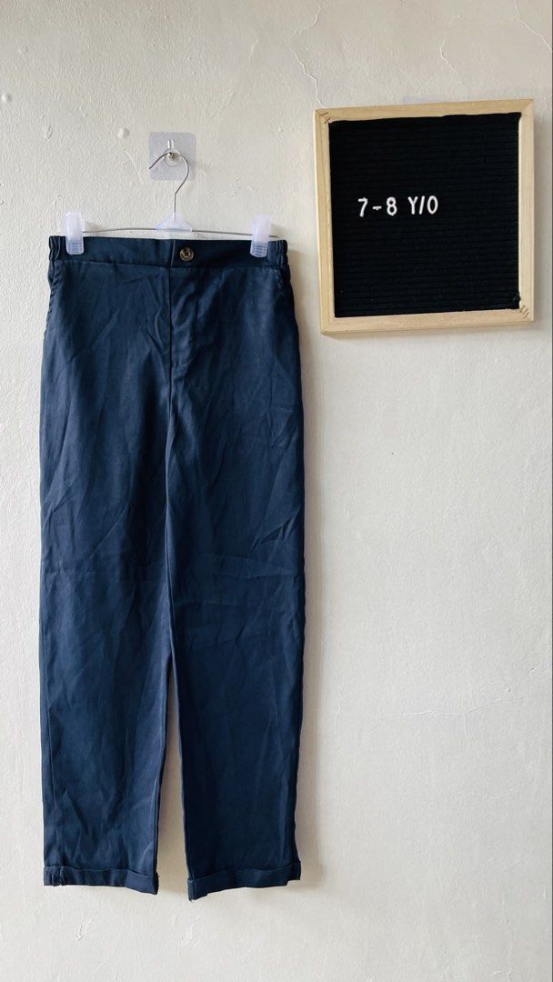 SHEIN Navy Blue Pants (Category: Babies & Kids Fashion) located in Caloocan City. Submitted by lovemyclothes21 (Listing ID 1469270988, Image 1). Description: - Brand: SHEIN - Size: 8Y (fits 7 to 8 years old) - Color: Navy Blue - Waistband: Elastic at the back with front button closure - Hem: Rolled cuffs - Style: Simple, everyday casual wear - Condition: Brand new / Excellent pre-loved (Ready to ship!).