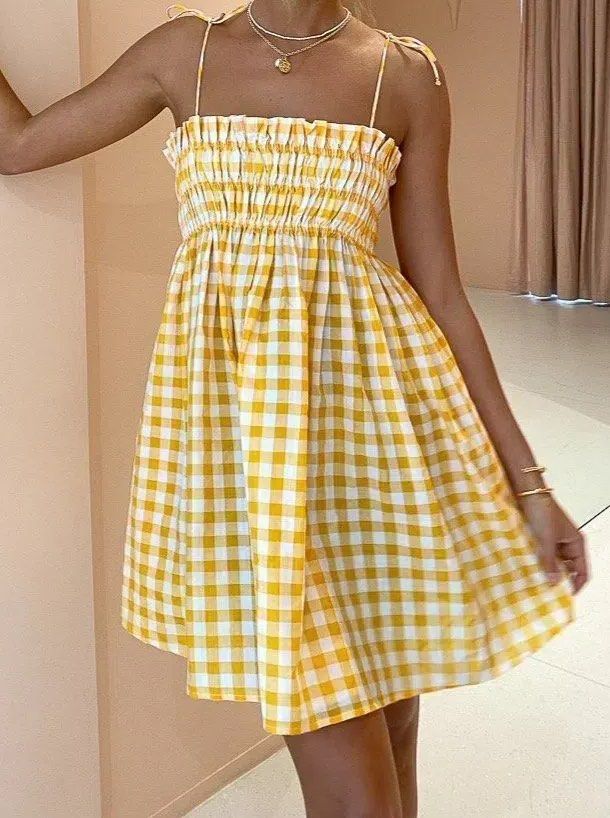 Shein Yellow Gingham Shirred Sundress (Category: Dresses) located in Caloocan City. Submitted by lovedbyryu (Listing ID 1468842941, Image 3). Description: - Brand: Shein - Style: Yellow & white gingham midi dress - Size: L (EU 40/42, US 8/10) - Details: Stretchy smocked bodice, ruffled neckline, and adjustable tie shoulder straps - Material: Lightweight fabric - Condition: Great for warm weather or casual days out.