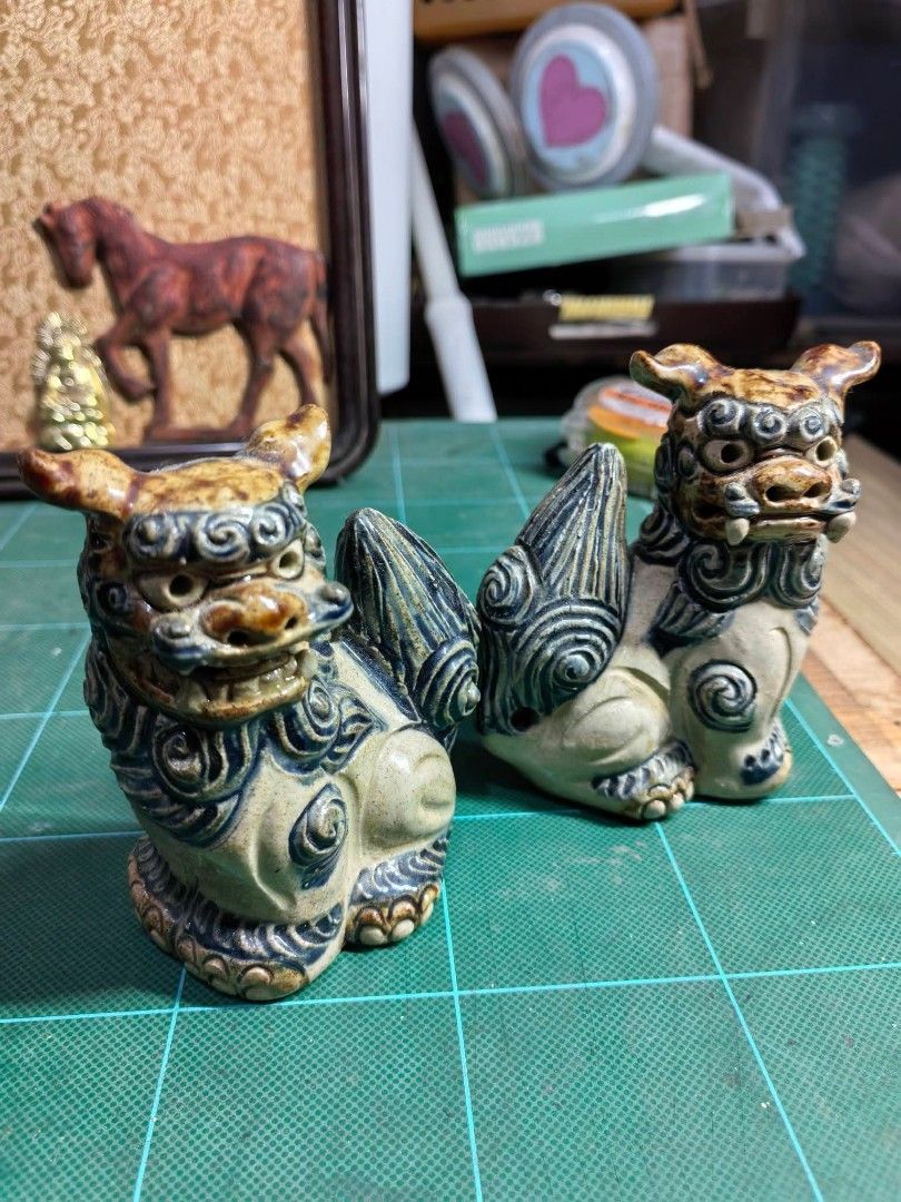 Shisa Lion Foo Dog Pair (Category: Other Home Decor) located in Cebu City. Submitted by dudes_villanueva (Listing ID 1469281142, Image 1). Description: Traditional Ryukyuan Shisa Lion Dog Pair (Okinawan Ceramic Statues) ​Pair of authentic Japanese traditional guardian lions (Shisa), handcrafted from heavy ceramic with classic glazed blue-and-earthy brown detailing over an off-white base. ​Dimensions: Length 3in x Width 2in x Height 4in ​Condition