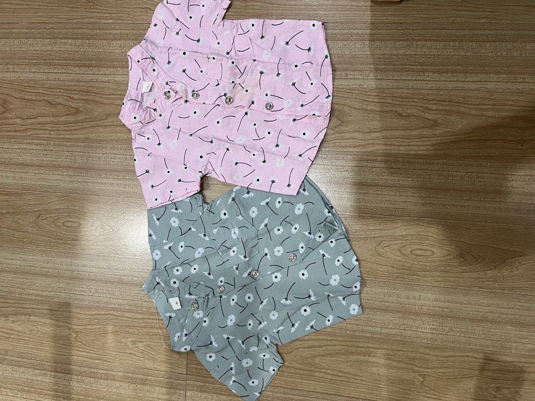 Short sleeve button up shirts bundle pink and grey (Category: Babies & Kids Fashion) located in Manila. Submitted by reloved.finds (Listing ID 1469186366, Image 1). Description: Take all - Set of 2 shirts: Pink and Grey - Adorable all-over dandelion floral print - Practical chest pocket detail - Lightweight and breathable fabric, perfect for warm weather - Size: Small (tags attached) - Sold together as a set.