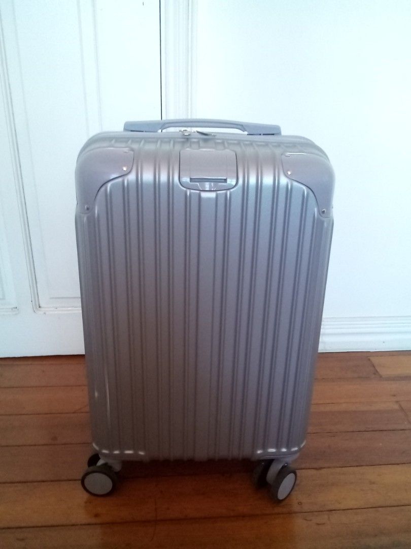 Silver cabin-size hardcase luggage (Category: Luggage) located in Makati City. Submitted by pinkeealvarez (Listing ID 1469205202, Image 2). Description: 14in x 9in x 20in.