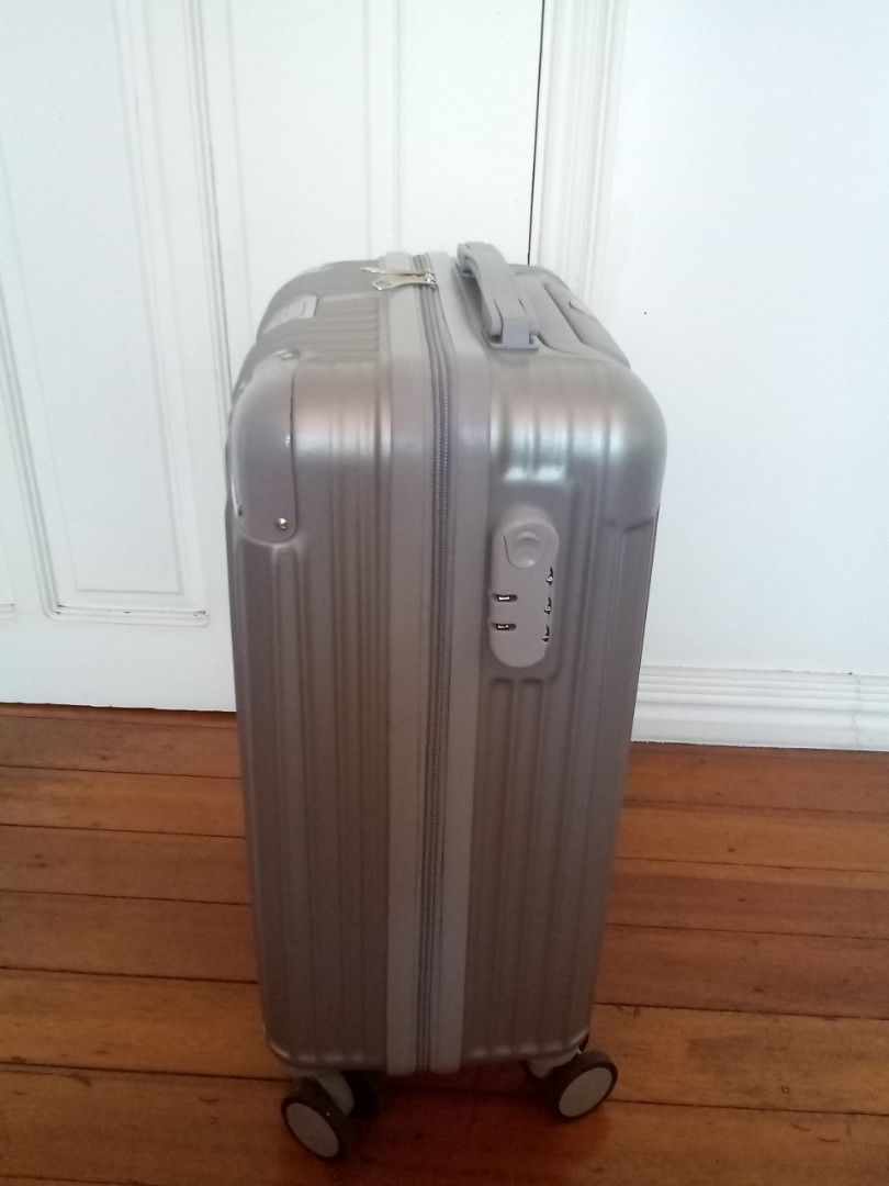 Silver cabin-size hardcase luggage (Category: Luggage) located in Makati City. Submitted by pinkeealvarez (Listing ID 1469205202, Image 3). Description: 14in x 9in x 20in.