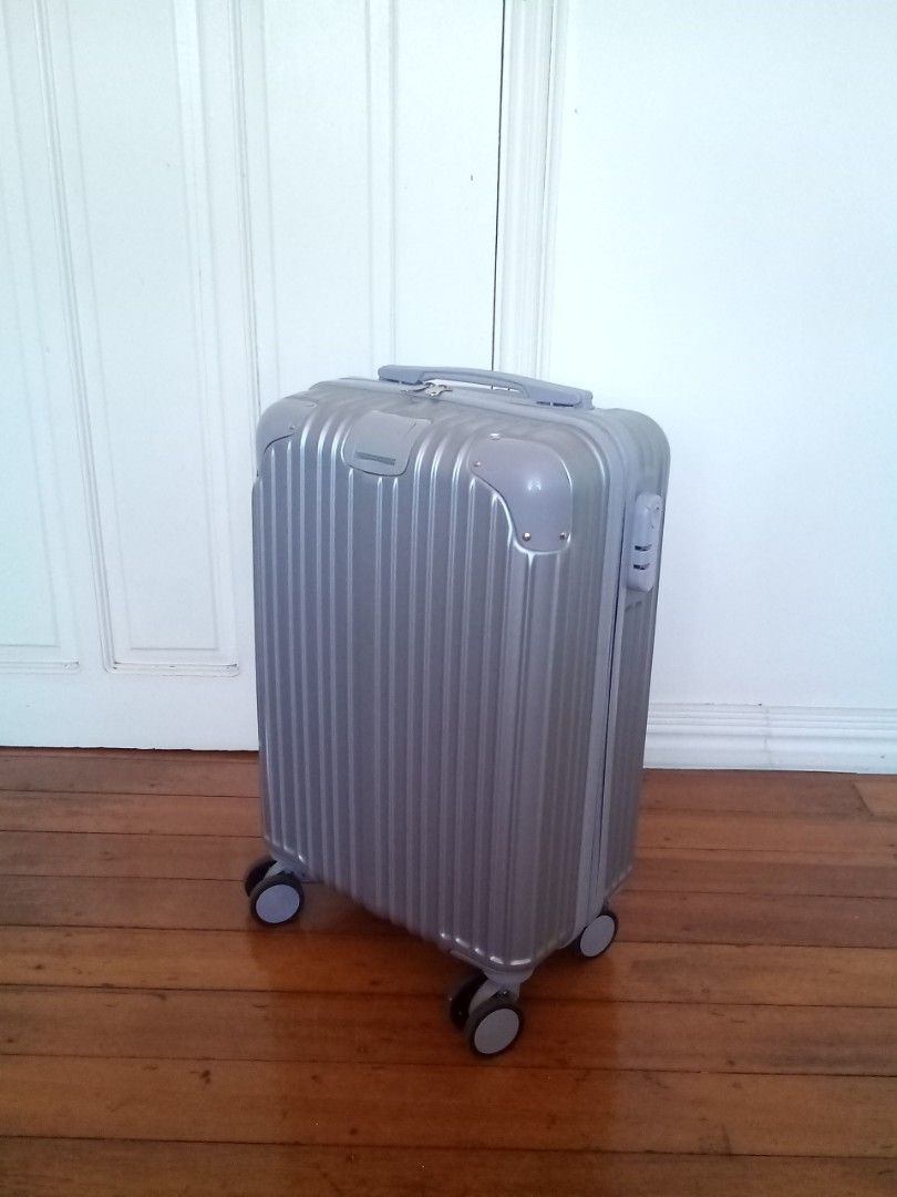 Silver cabin-size hardcase luggage (Category: Luggage) located in Makati City. Submitted by pinkeealvarez (Listing ID 1469205202, Image 1). Description: 14in x 9in x 20in.