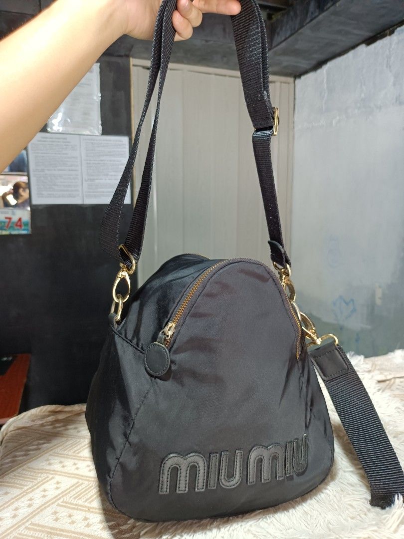 Sling bag miumiu nylon semi med. (Category: Sling Bags) located in Naga. Submitted by zksboutique (Listing ID 1469203522, Image 1). Description: Very good condition Nylon Sling bag miumiu with Microchip no issue.