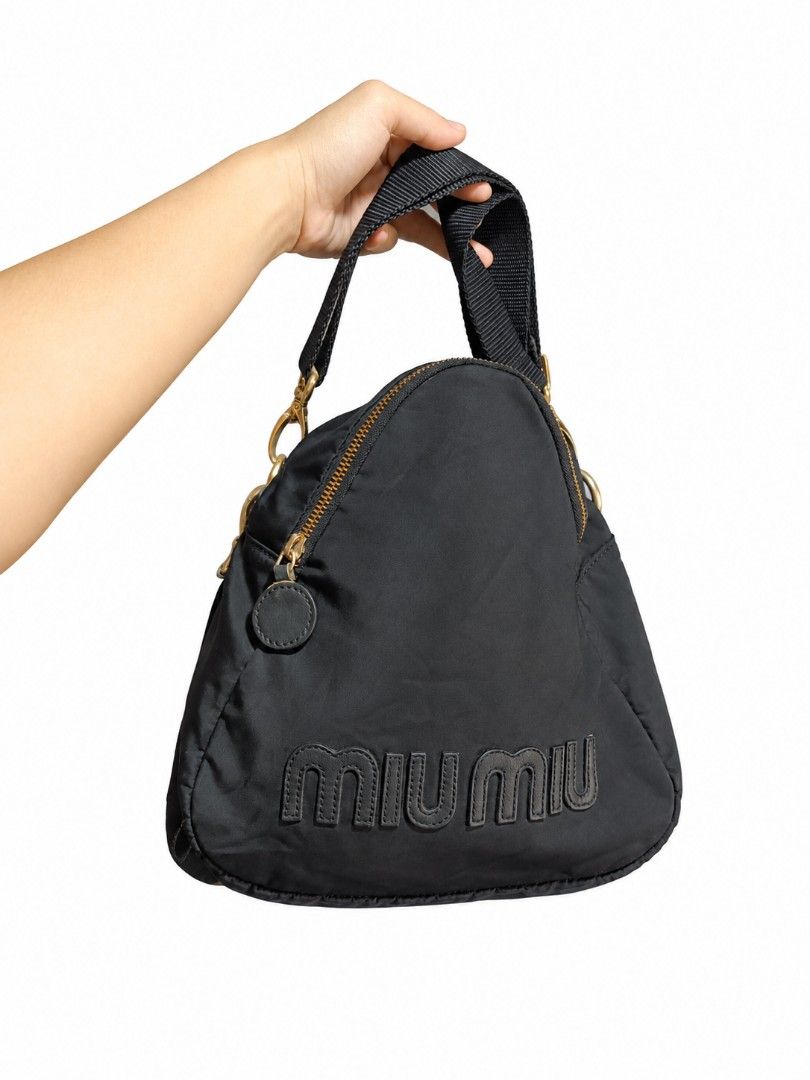 Sling bag miumiu nylon semi med. (Category: Sling Bags) located in Naga. Submitted by zksboutique (Listing ID 1469203522, Image 2). Description: Very good condition Nylon Sling bag miumiu with Microchip no issue.