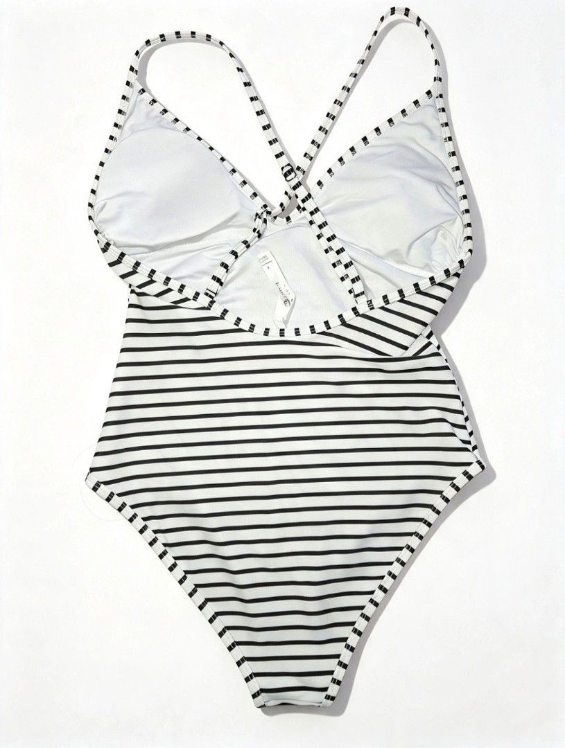 SMALL Cupshe padded striped one-piece swimsuit (Category: Bikinis & Swimsuits) located in Quezon City. Submitted by ana-chan (Listing ID 1469164711, Image 2). Description: Chic black and white striped one-piece swimsuit featuring a flattering V-neck, adjustable criss-cross back straps, and removable padding. Perfect for your next beach getaway!.