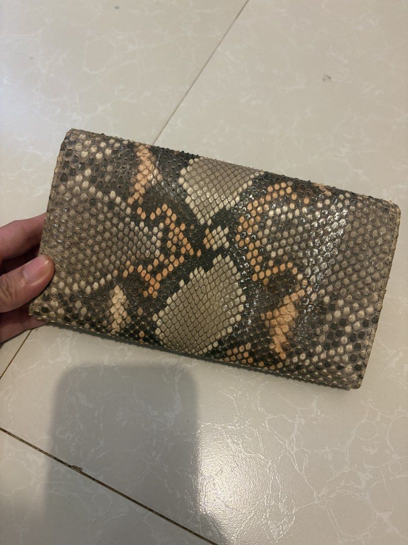 ísola Japan Genuine Snakeskin Python Long Wallet (Category: Wallets & Card holders) located in Las Pinas. Submitted by bibliomomma (Listing ID 1469239417, Image 2). Description: Authentic Japanese Ísola ottanta-sette long wallet featuring a genuine python/snakeskin exterior paired with a mustard yellow leather interior. Designed with a silver push lock clasp, multiple accordion compartments, card slots, and a rear zippered pocket for maximum orga