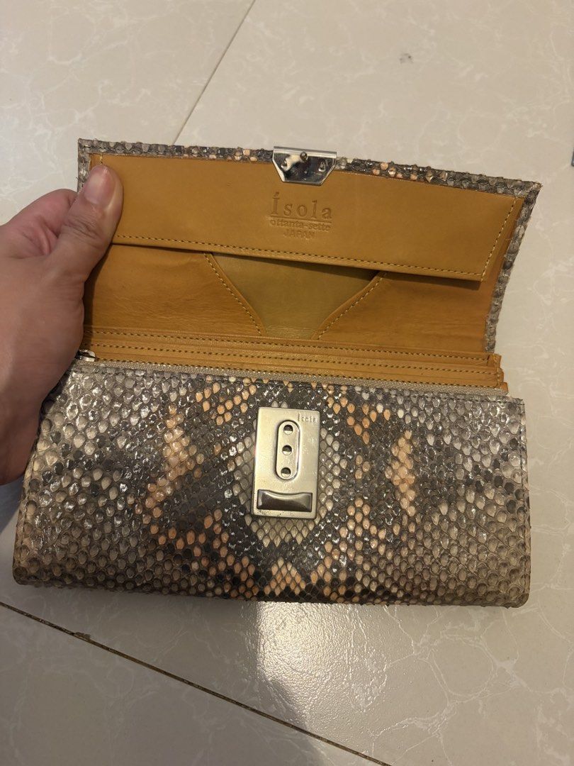 ísola Japan Genuine Snakeskin Python Long Wallet (Category: Wallets & Card holders) located in Las Pinas. Submitted by bibliomomma (Listing ID 1469239417, Image 3). Description: Authentic Japanese Ísola ottanta-sette long wallet featuring a genuine python/snakeskin exterior paired with a mustard yellow leather interior. Designed with a silver push lock clasp, multiple accordion compartments, card slots, and a rear zippered pocket for maximum orga