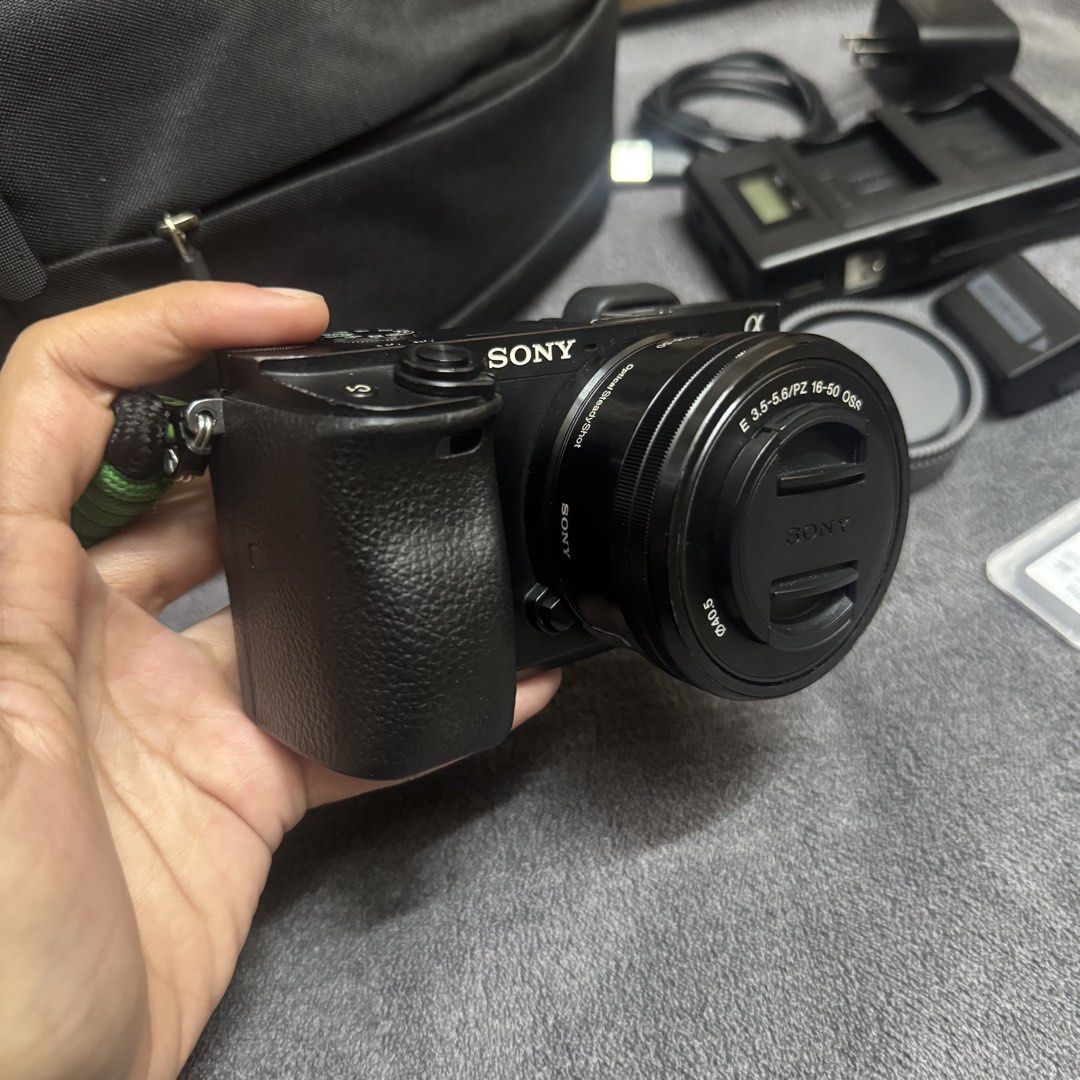 Sony A6300 Mirrorless Camera (Category: Cameras) located in Cavite. Submitted by 35mmarq (Listing ID 1469360561, Image 1). Description: Sony A6300 Mirrorless Camera Shutter count: 52k Key Features: - 24.2-megapixel CMOS sensor - Can record 4K videos - BIONZ X Image Processor Inclusions: - Sony A6300 body - Sony E PZ 16-50mm OSS lens - 32gb SD card - (2) third party batteries - Battery charger - Cord - Lens cap and cover - Lens hood - Camera bag -