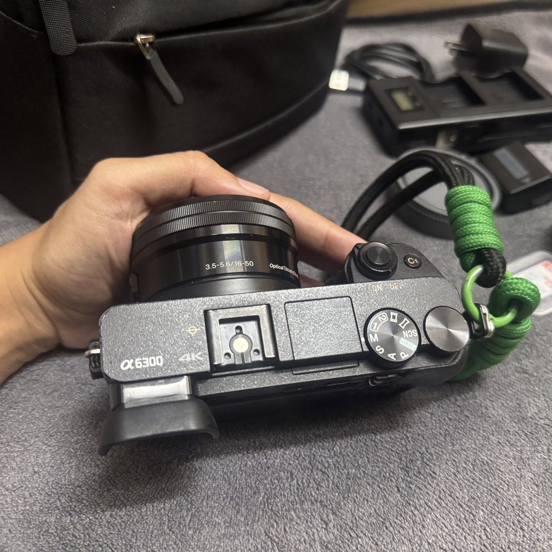 Sony A6300 Mirrorless Camera (Category: Cameras) located in Cavite. Submitted by 35mmarq (Listing ID 1469360561, Image 3). Description: Sony A6300 Mirrorless Camera Shutter count: 52k Key Features: - 24.2-megapixel CMOS sensor - Can record 4K videos - BIONZ X Image Processor Inclusions: - Sony A6300 body - Sony E PZ 16-50mm OSS lens - 32gb SD card - (2) third party batteries - Battery charger - Cord - Lens cap and cover - Lens hood - Camera bag -
