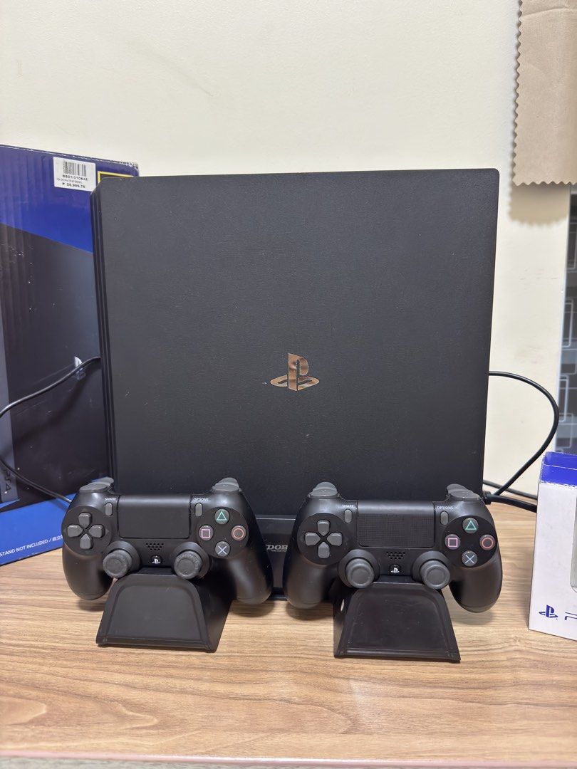 Sony PlayStation 4 Pro 1TB Console with 2 Controllers and UFC 3 (Category: PlayStation) located in Manila. Submitted by seayouncey (Listing ID 1469289278, Image 3). Description: - Console: Sony PlayStation 4 Pro 1TB in Jet Black (fully working, original box included) - Controllers: 2 x Original DualShock 4 wireless controllers - Accessories: Dual controller charging docks included - Game: UFC 3 physical game disc - Condition: Excellent setup, rea