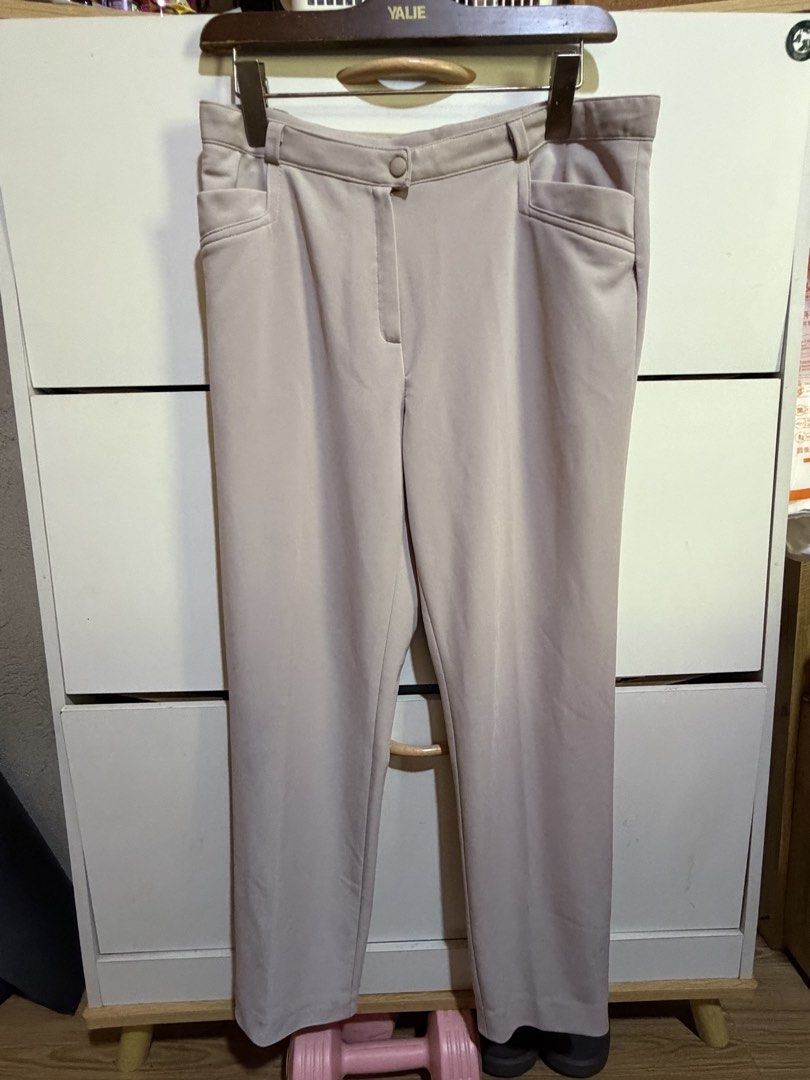 ST Coll Beige Trousers Size 32 (Category: Other Bottoms) located in Siquijor. Submitted by yhostuff (Listing ID 1469180223, Image 2). Description: - Brand: ST Coll - Size: 32 (tag inside) - Color: Classic beige, solid pattern - Details: Structured waistband, belt loops, front zip fly, and button closure - Pockets: Slanted front pockets and back patch pockets - Style: Clean hem lines, perfect for smart casual outfits Waist:30-31” Length: 36”.