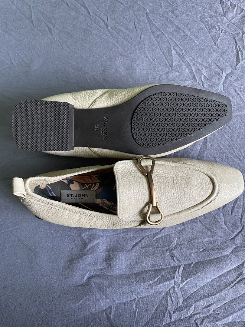 St. John Blue Label Beige Loafers Size 230 (Category: Loafers) located in Cagayan de Oro. Submitted by jekdels05 (Listing ID 1469164047, Image 1). Description: - Brand: St. John Blue Label - Material: Off-white textured leather with fun patterned fabric lining - Details: Gold-tone hardware on front strap, slip-on design - Heel & Sole: Structured square heel with patterned rubber grip soles - Size: 230 stamped on bottom.