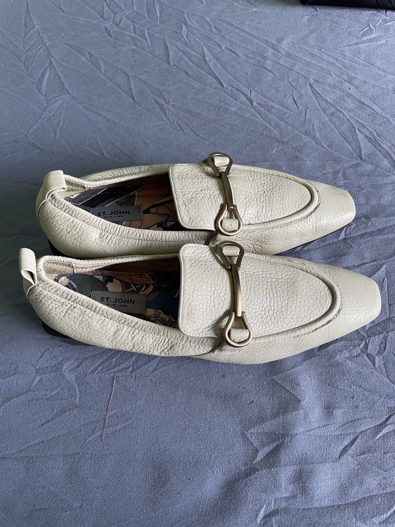 St. John Blue Label Beige Loafers Size 230 (Category: Loafers) located in Cagayan de Oro. Submitted by jekdels05 (Listing ID 1469164047, Image 3). Description: - Brand: St. John Blue Label - Material: Off-white textured leather with fun patterned fabric lining - Details: Gold-tone hardware on front strap, slip-on design - Heel & Sole: Structured square heel with patterned rubber grip soles - Size: 230 stamped on bottom.