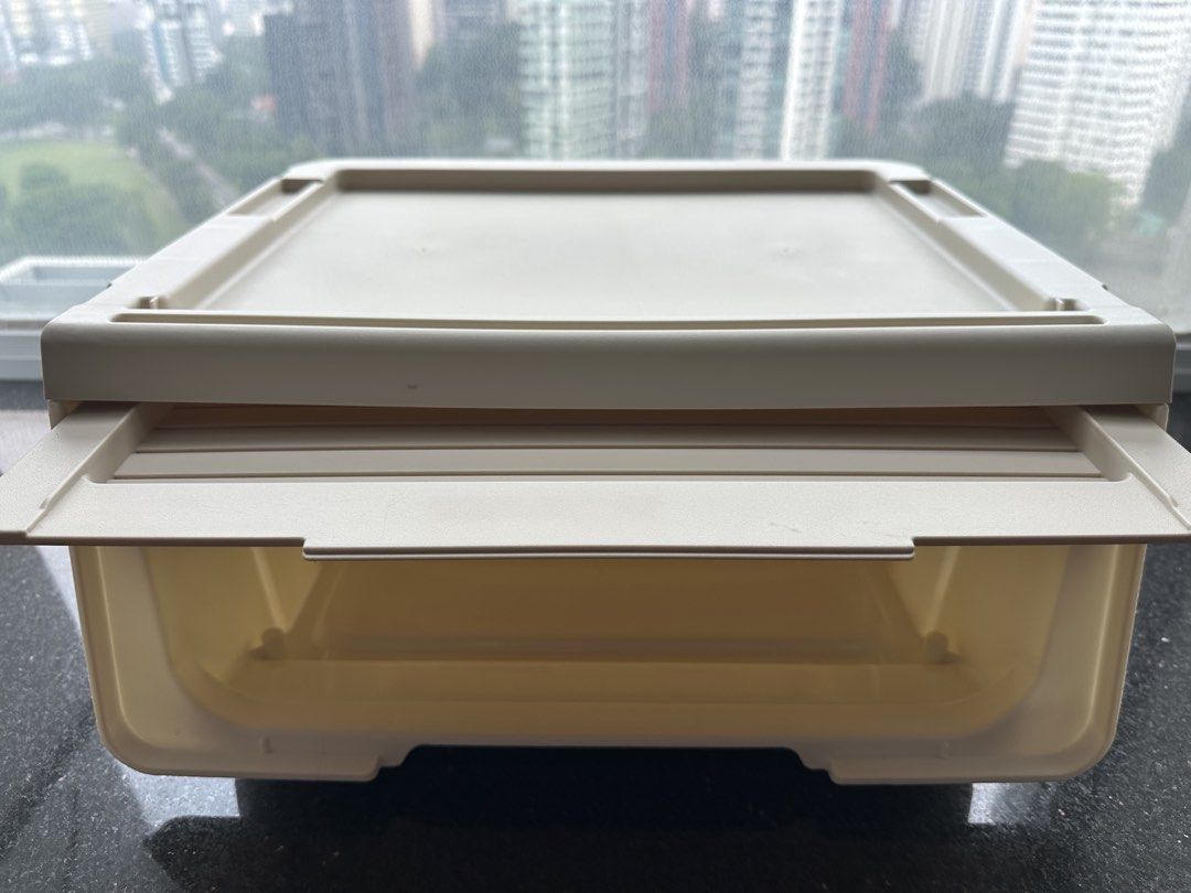 Stackable storage box (Category: Storage Boxes & Baskets) located in Singapore. Submitted by eug7007y (Listing ID 1469248511, Image 2). Description: - Color: Beige - Material: Sturdy plastic - Design: Ribbed front panel drawer door - Features: Flat top lid for stacking - Ideal for: Organizing clothes, toys, and desk supplies.