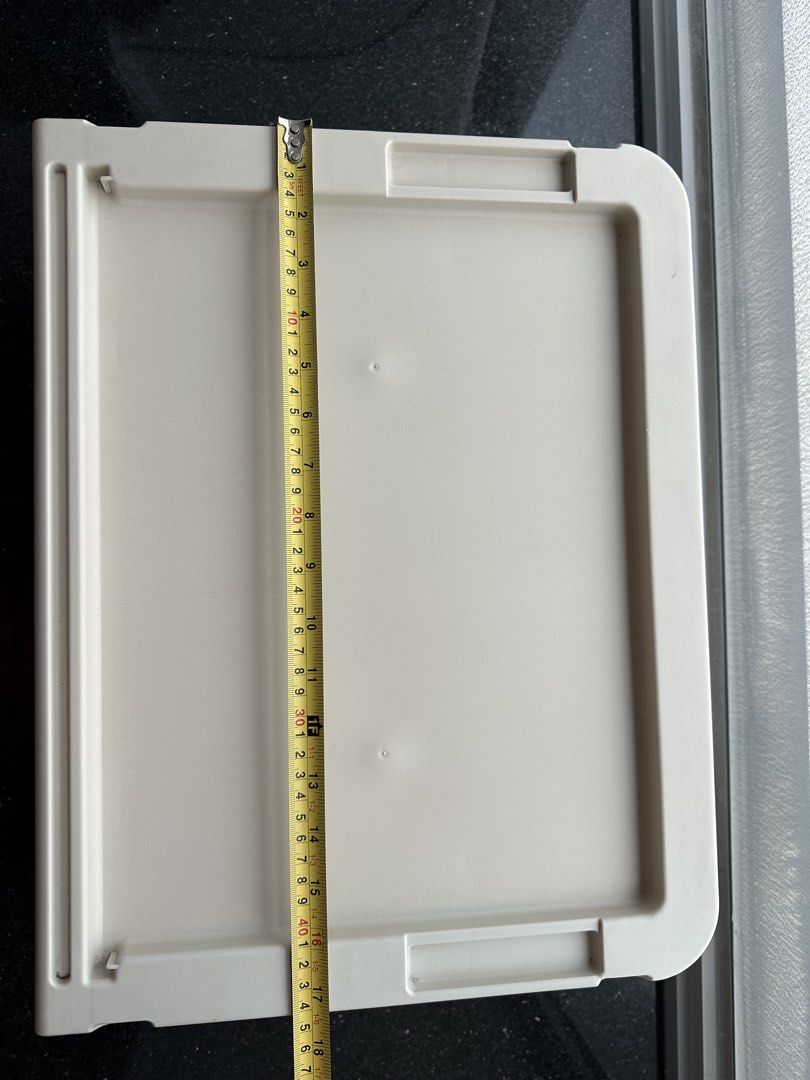 Stackable storage box (Category: Storage Boxes & Baskets) located in Singapore. Submitted by eug7007y (Listing ID 1469248511, Image 3). Description: - Color: Beige - Material: Sturdy plastic - Design: Ribbed front panel drawer door - Features: Flat top lid for stacking - Ideal for: Organizing clothes, toys, and desk supplies.