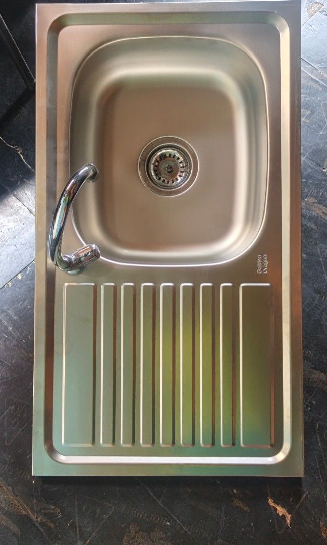 Stainless kitchen sink with drainboard (Category: Home Improvement Tools & Accessories) located in Manila. Submitted by muranglababo_ph2026 (Listing ID 1469201837, Image 1). Description: SULIT PRESYO! STAINLESS KITCHEN SINK – COMPLETE SET 🔥 ✔️ May drainboard ✔️ 17 x 30 inches ✔️ 6 inches deep – hindi talsik ang tubig ✔️ Matibay at madaling linisin ✔️ Complete set na (may fitting at drain at gripo) 💰 ₱1,500 NA LANG! Perfect para sa bahay, apartm