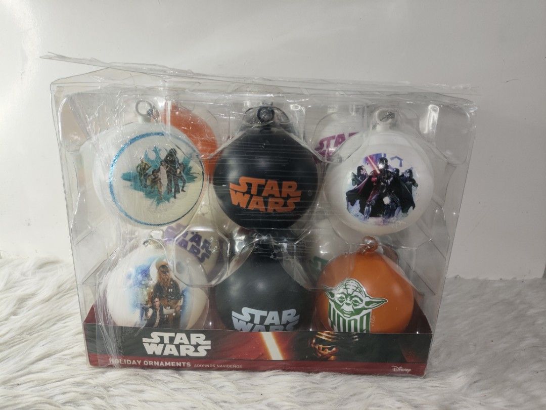 Star Wars Holiday Ornaments Set Christmas Tree Decor (Category: Western Merchandise) located in Cavite. Submitted by tinetaclesss (Listing ID 1469309823, Image 1). Description: - Official Star Wars holiday ornaments boxed set - Includes iconic character baubles: Yoda, Darth Vader, and Chewbacca - Features classic logo designs in a stylish black, white, and orange color scheme - Brand new with intact clear plastic packaging - Makes a great gift an