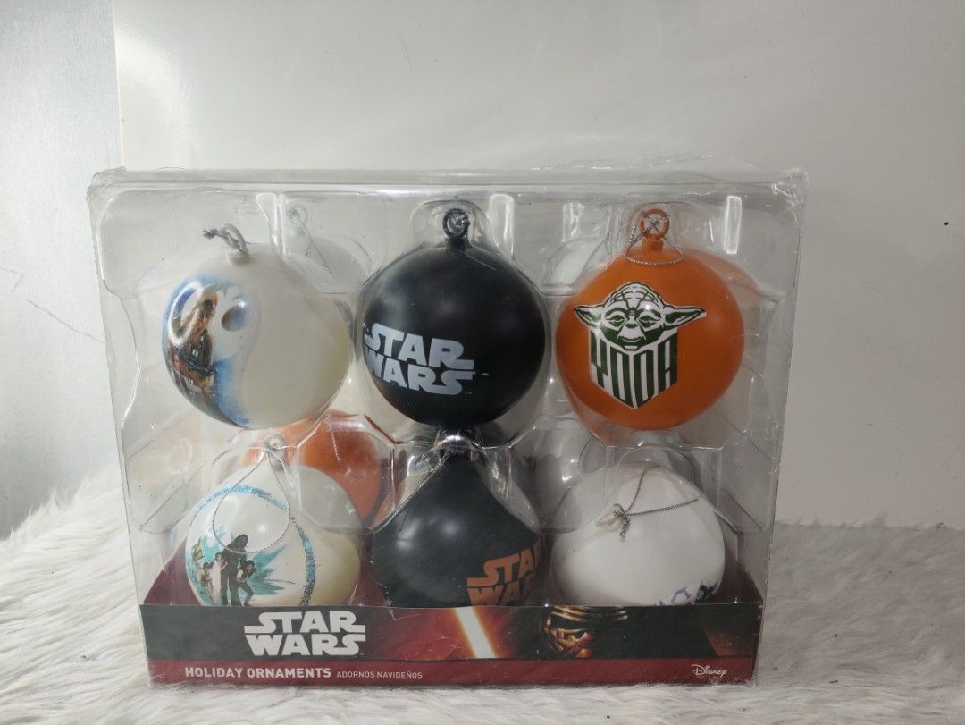 Star Wars Holiday Ornaments Set Christmas Tree Decor (Category: Western Merchandise) located in Cavite. Submitted by tinetaclesss (Listing ID 1469309823, Image 2). Description: - Official Star Wars holiday ornaments boxed set - Includes iconic character baubles: Yoda, Darth Vader, and Chewbacca - Features classic logo designs in a stylish black, white, and orange color scheme - Brand new with intact clear plastic packaging - Makes a great gift an