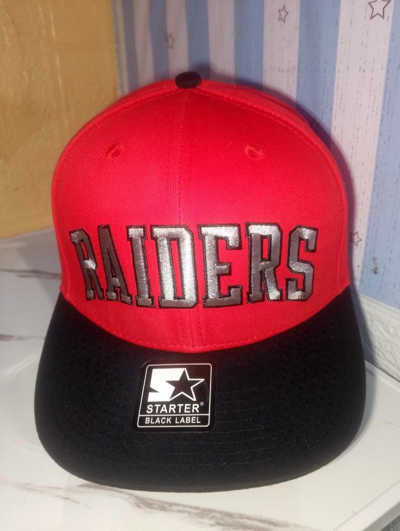 Starter Black Label Las Vegas Raiders Cap (Category: Caps & Hats) located in Manila. Submitted by frenchieal71480 (Listing ID 1469210067, Image 2). Description: - Authentic Starter Black Label Las Vegas Raiders snapback hat - Striking red crown with a sleek black flat brim - Bold silver embroidered Raiders lettering across the front - Classic team shield patch on the side - Adjustable snap closure for a comfortable fit - Original sticker still at