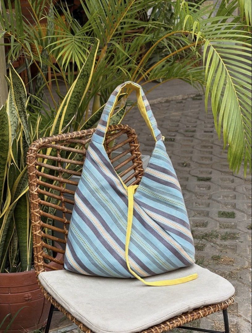 Straw Origami bag by @by___timmy (Category: Tote Bags) located in Manila. Submitted by o813th (Listing ID 1469201079, Image 1). Description: - Alon from Exclusive Summer Collection (already phased out) - outer material: straw textile - inner material: canvas - tie closure - bought for 1.5k (used twice only) - can fit 14" laptop or ipad and very spacious.