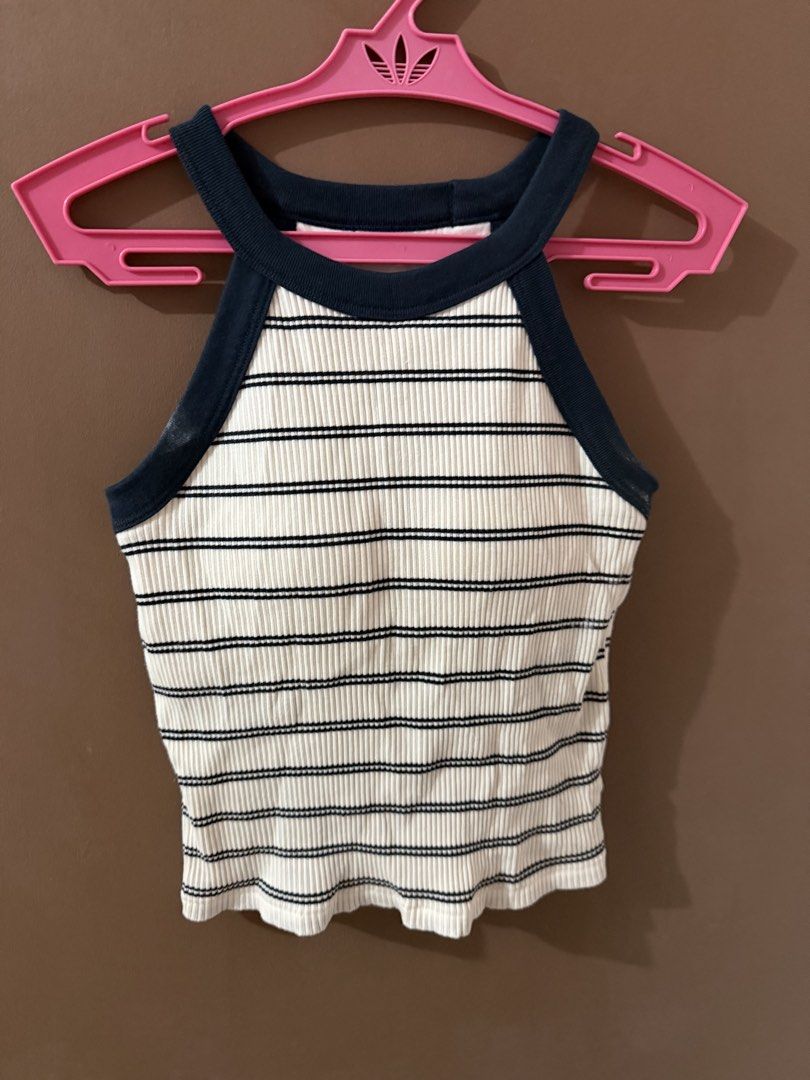 Striped Ribbed Halter Neck Crop Top Size S (Category: Sleeveless) located in Davao. Submitted by fabdeclutter (Listing ID 1469379810, Image 3). Description: - Style: Black and white striped ribbed crop top with halter neckline and navy blue trim - Size: S - Material: 93% cotton, 7% spandex for a soft and comfortable fit - Condition: Worn only a few times, freshly washed, and properly stored - Perfect for: Casual daily outfits and effortless styli