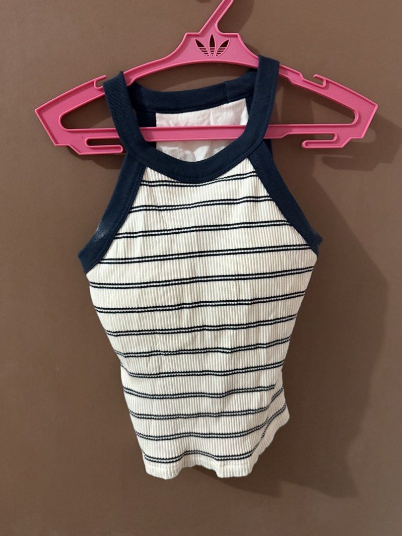 Striped Ribbed Halter Neck Crop Top Size S (Category: Sleeveless) located in Davao. Submitted by fabdeclutter (Listing ID 1469379810, Image 1). Description: - Style: Black and white striped ribbed crop top with halter neckline and navy blue trim - Size: S - Material: 93% cotton, 7% spandex for a soft and comfortable fit - Condition: Worn only a few times, freshly washed, and properly stored - Perfect for: Casual daily outfits and effortless styli